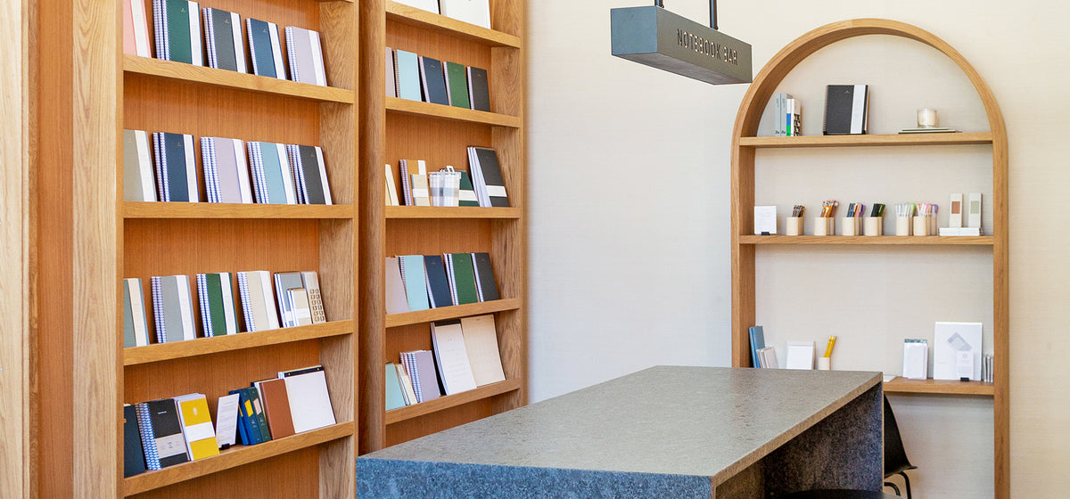 The Appointed District Shop in Ivy City, D.C. shows a wall of Appointed products, Notebook Bar, and featured desk accessories